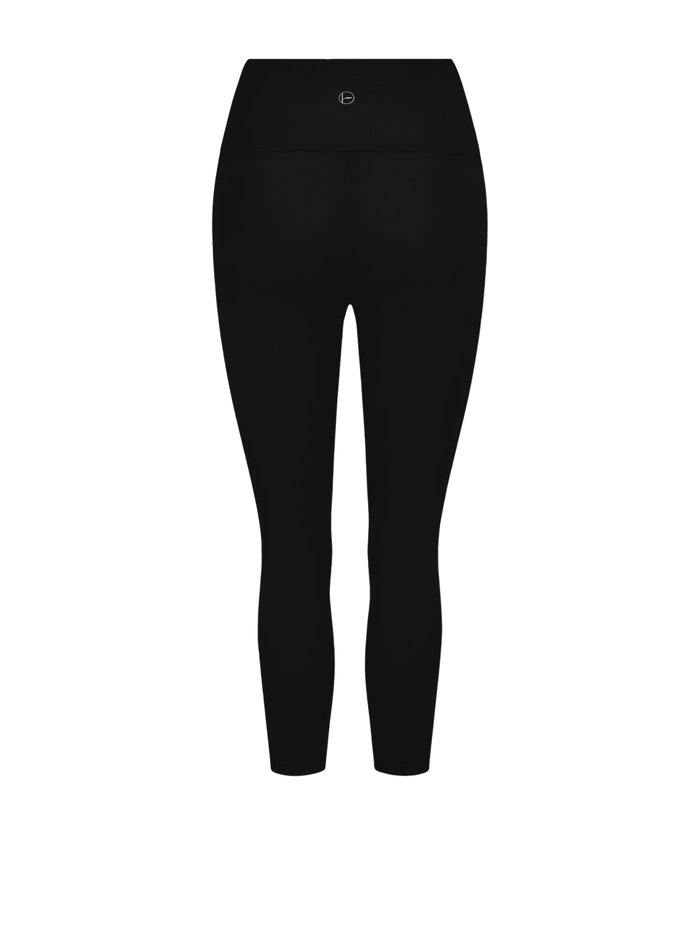 A pair of high-waisted, 3/4  length leggings in a black shown on a plain white background.