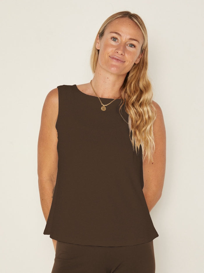 Model wearing a cocoa brown boat neck singlet with wide shoulder coverage, women's bamboo clothing