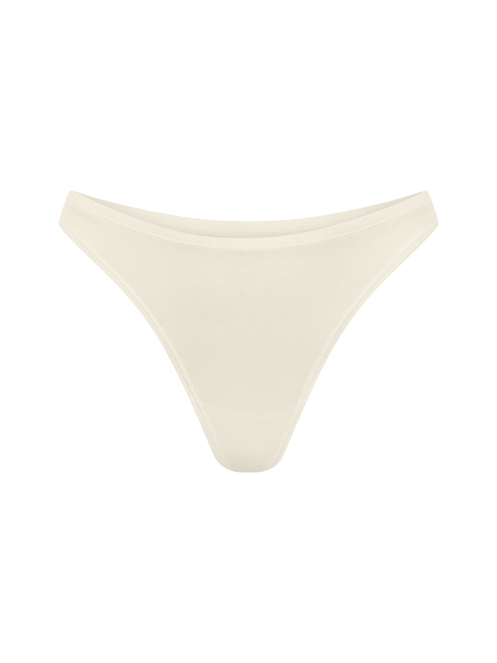 Bamboo cream classic thong g-string underpants on a white background