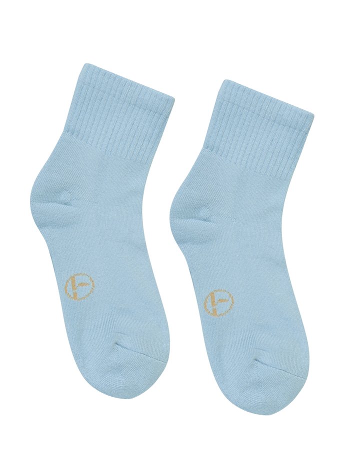 Pair of light blue bamboo socks with a logo on a white background