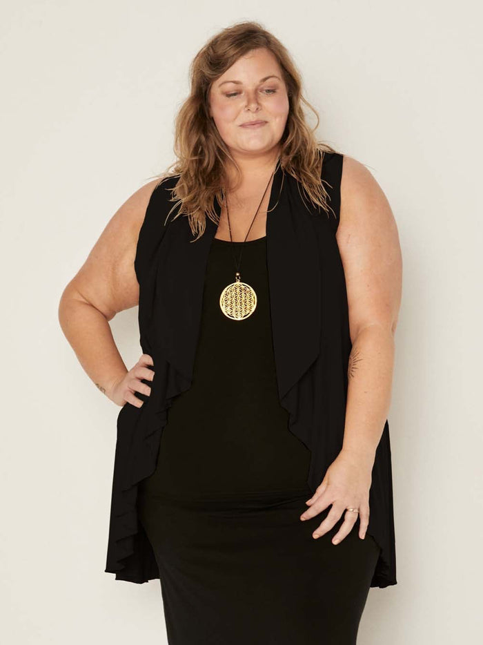 Model wearing a black convertible style goddess wrap; long cardi, vest or poncho, women's bamboo clothing