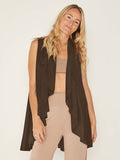 Model wearing a cocoa brown convertible style goddess wrap; long cardi, vest or poncho, women's bamboo clothing