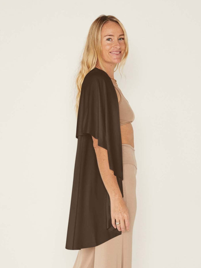 Model wearing a cocoa brown convertible style goddess wrap; long cardi, vest or poncho, women's bamboo clothing