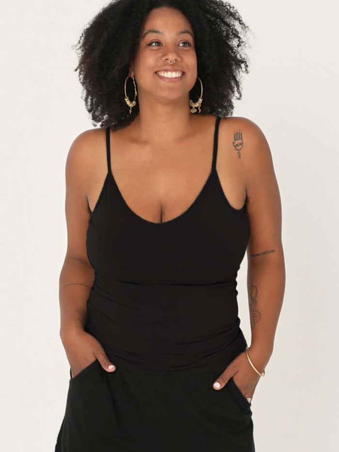 Model wearing a black layering singlet with camisole straps, v neckline and fitted body, women's bamboo clothing
