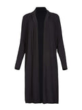 Model wearing black long cardigan, below knee length jacket with long fitted sleeves, women's bamboo clothing