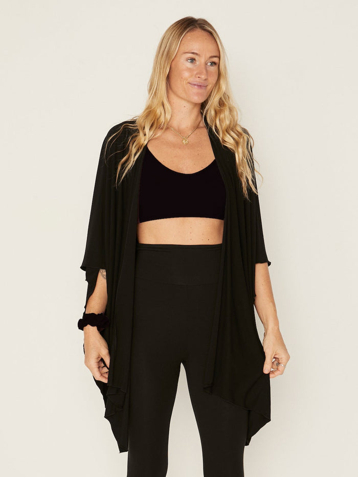 Model wearing black large shawl, nourishing wrap, women's bamboo clothing