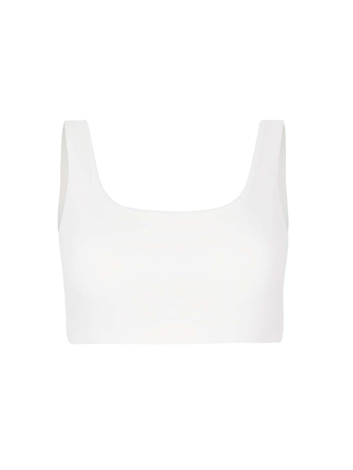 Model wearing eucalyptus cream reversible bra, high or low scoop neckline and wide shoulder straps, wireless bra, women's bamboo underwear
