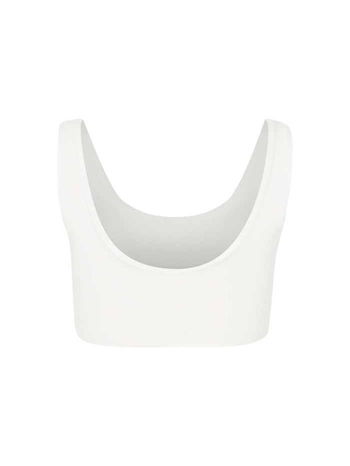 Model wearing eucalyptus cream reversible bra, high or low scoop neckline and wide shoulder straps, wireless bra, women's bamboo underwear