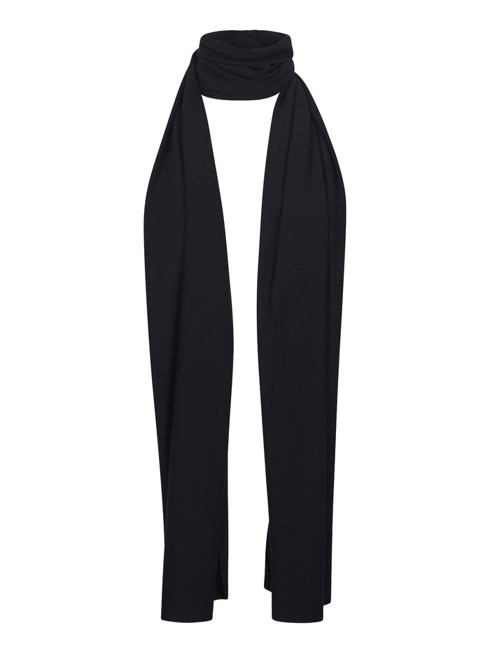 Model wearing black large scarf, convertible style worn as scarf, wrap and shawl, women's bamboo clothing accessories