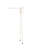 Model wearing cream long thin string belt with brown wooden bead tied at both ends, women's bamboo clothing accessories