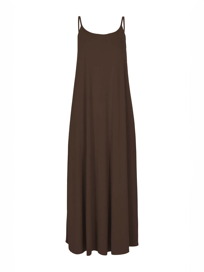 Model wearing a cocoa brown swing maxi dress with a scoop neck and elasticated camisole straps, women's bamboo clothing