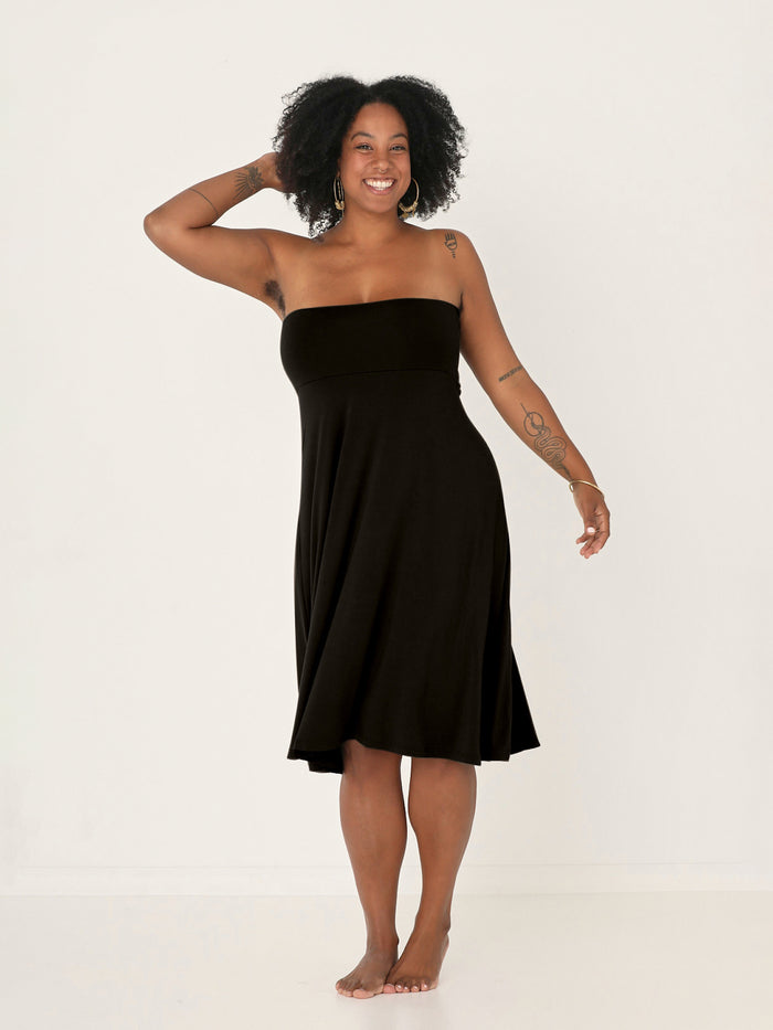 Model wearing black swing style long swishy skirt, mid - low calf length, double layered deep waistband, women's bamboo clothing