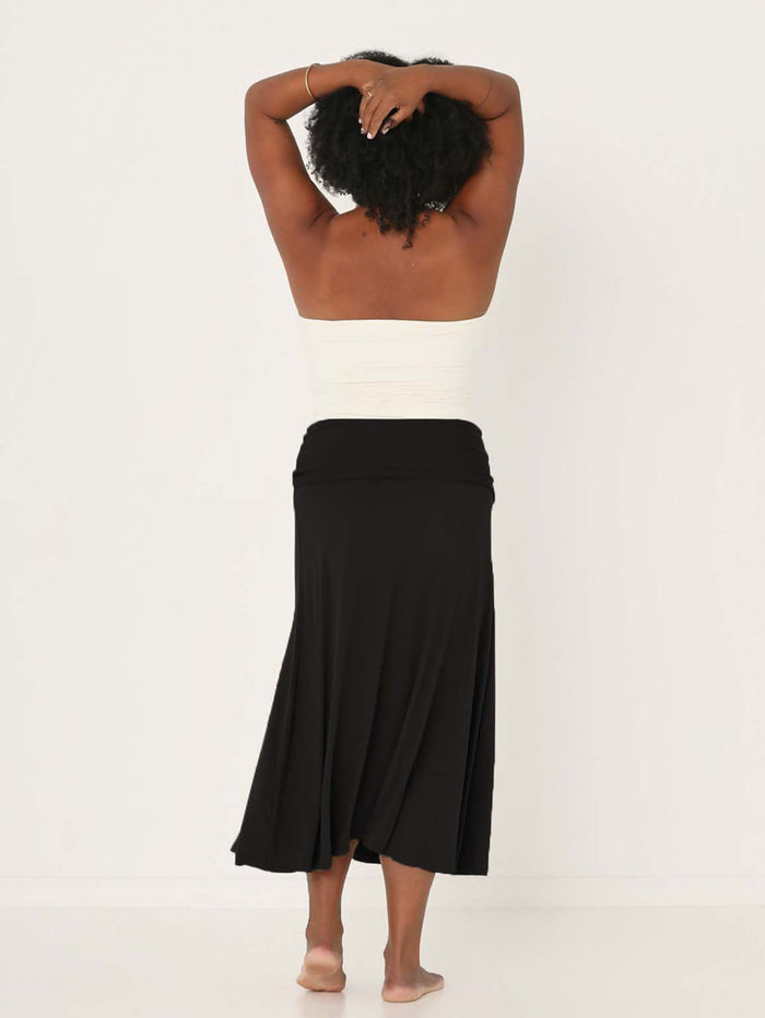 Model wearing black swing style long swishy skirt, mid - low calf length, double layered deep waistband, women's bamboo clothing