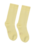 Pair of light yellow bamboo socks on a white background