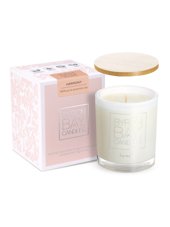 Byron Bay harmony essential oil candle with a wooden lid and packaging on a white background