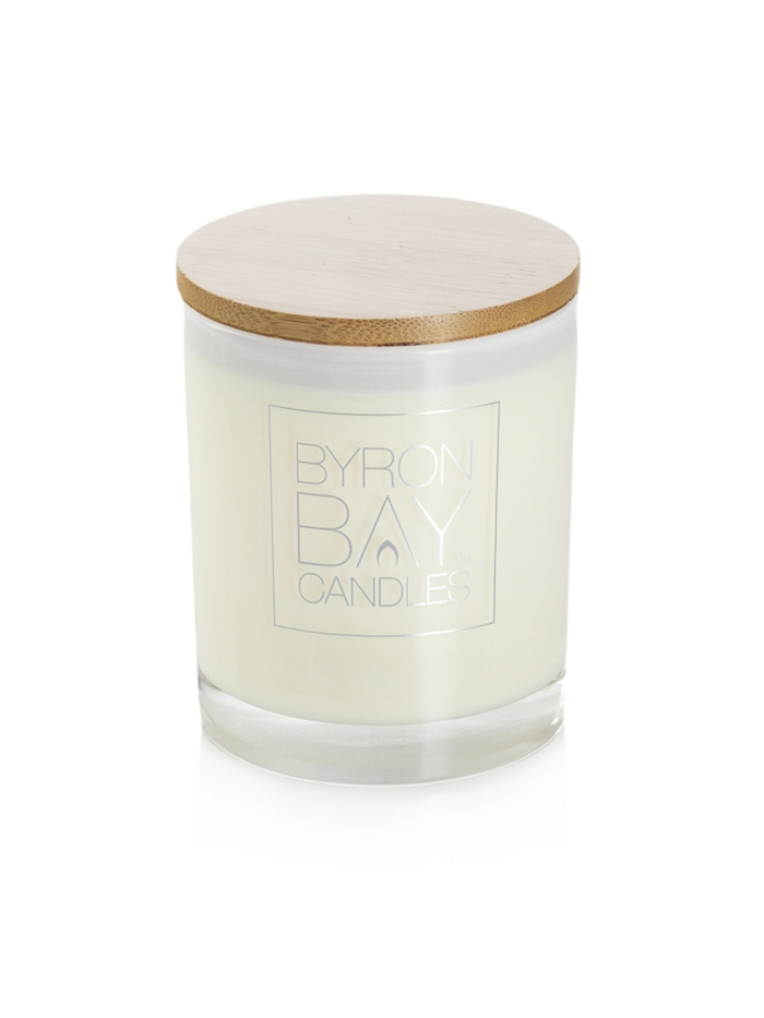 Candle with a wooden lid on a white background, branded 'Byron Bay Candles'