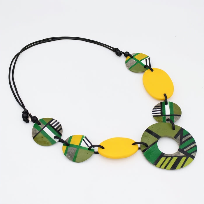 Necklace with colorful geometric beads on a white background