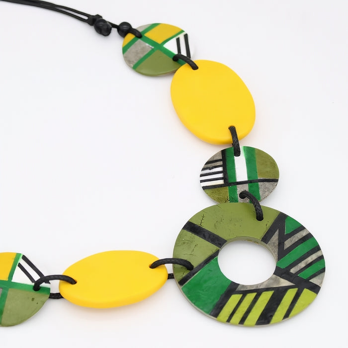 Necklace with colorful circular beads on a white background