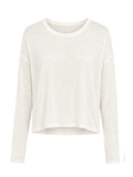 A long-sleeve cropped knit top in a warm off-white color, displayed against a solid white background.