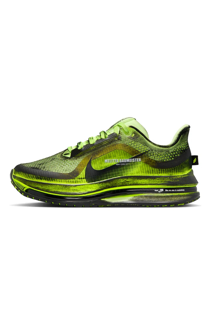 Black and green sneaker on a white background