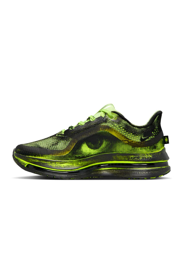 Black and green sneaker on a white background