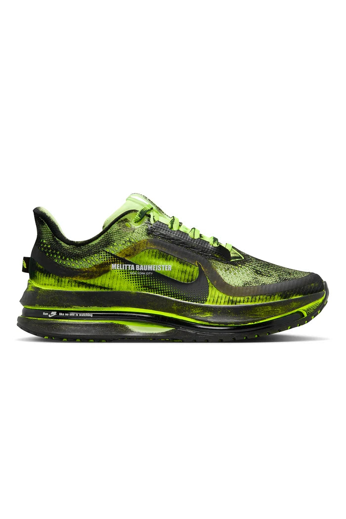 Black and green sneaker on a white background