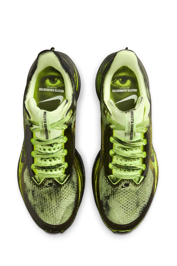 Black and green sneaker on a white background