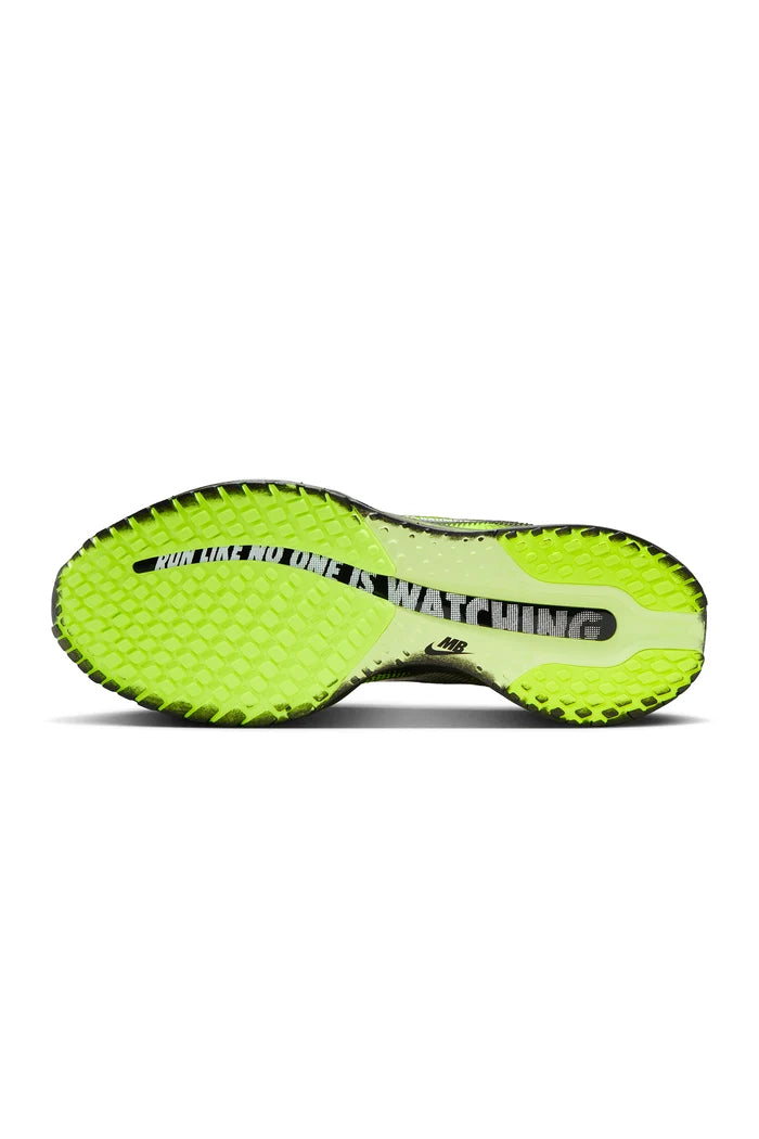 Black and green sneaker on a white background