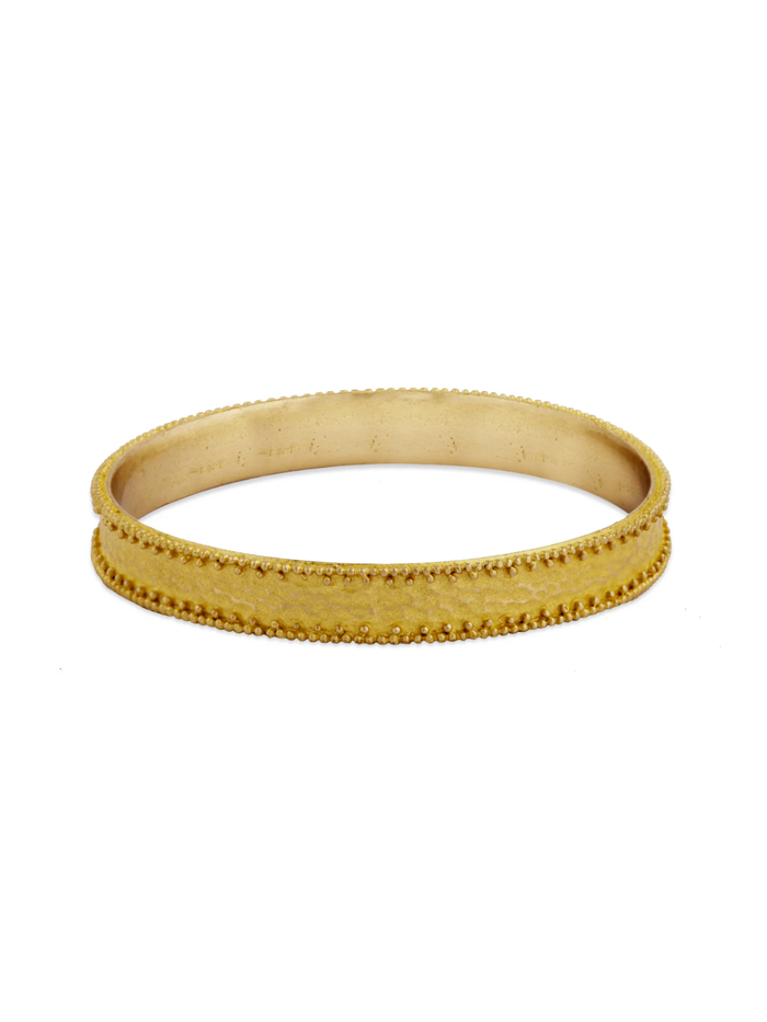Gold bracelet on a white background