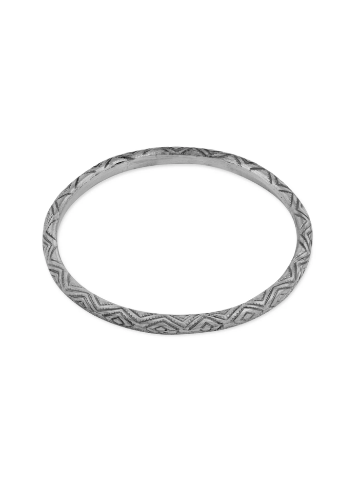 Silver bracelet with a pattern on a white background
