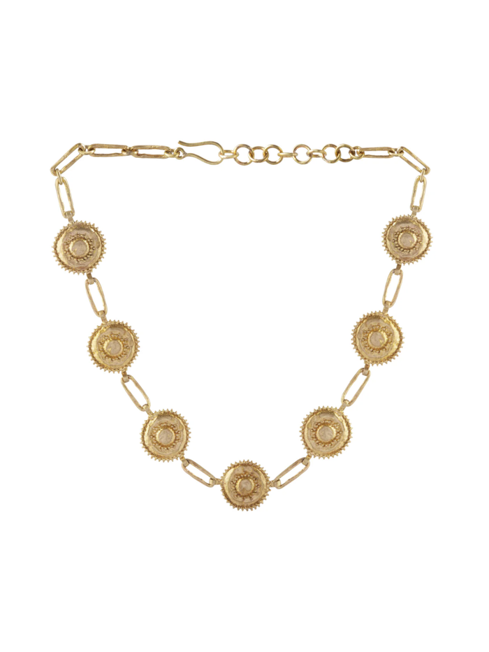 Gold necklace with circular links on a white background