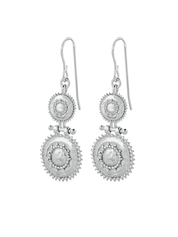 Pair of silver earrings with circular designs on a white background