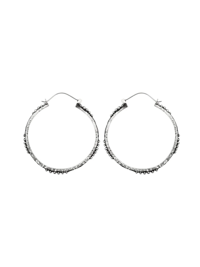 Pair of silver hoop earrings on a white background