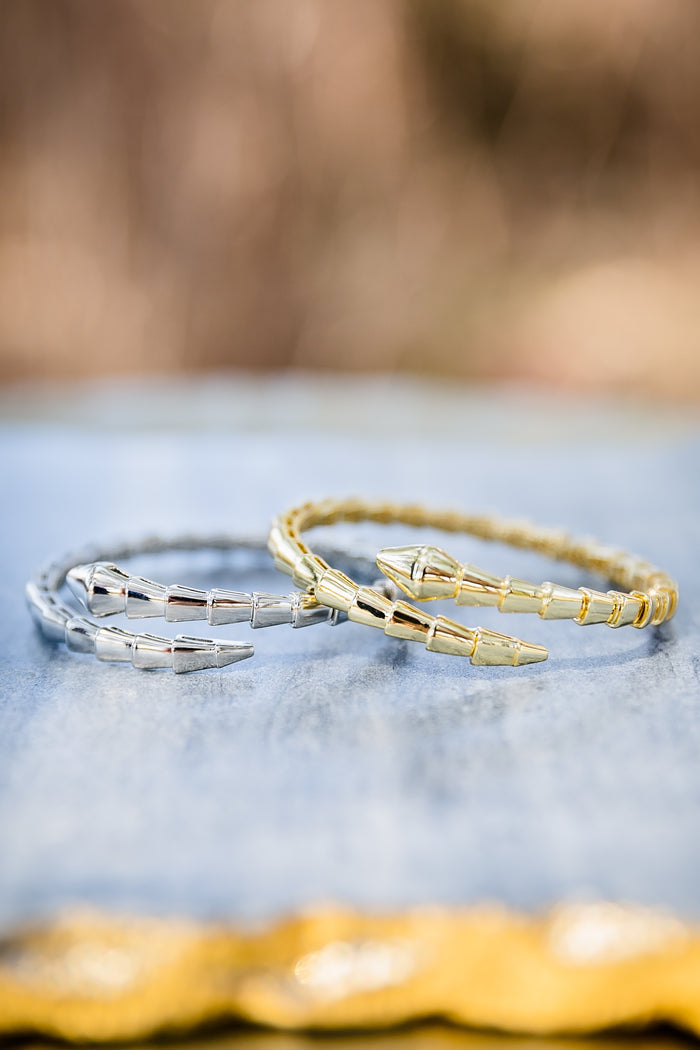 Night Coil bangle bracelets in gold and silver tones featuring coil design and 14kt gold plating on brass base