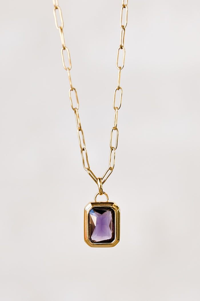 Nightfall gold pendant necklace with rectangular zircon stone displayed in a clean minimal styling