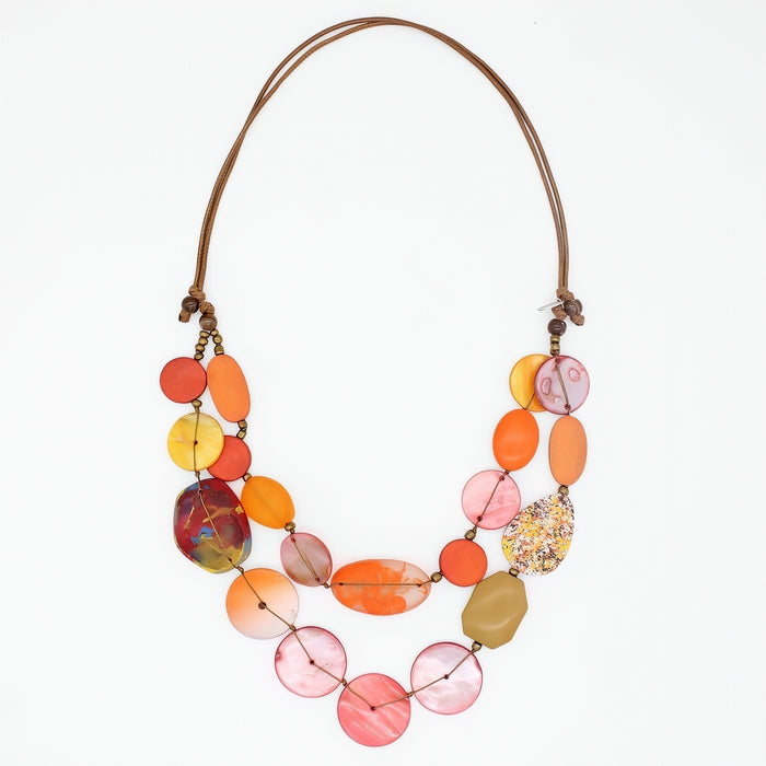 Colorful necklace with multicolored beads on a white background