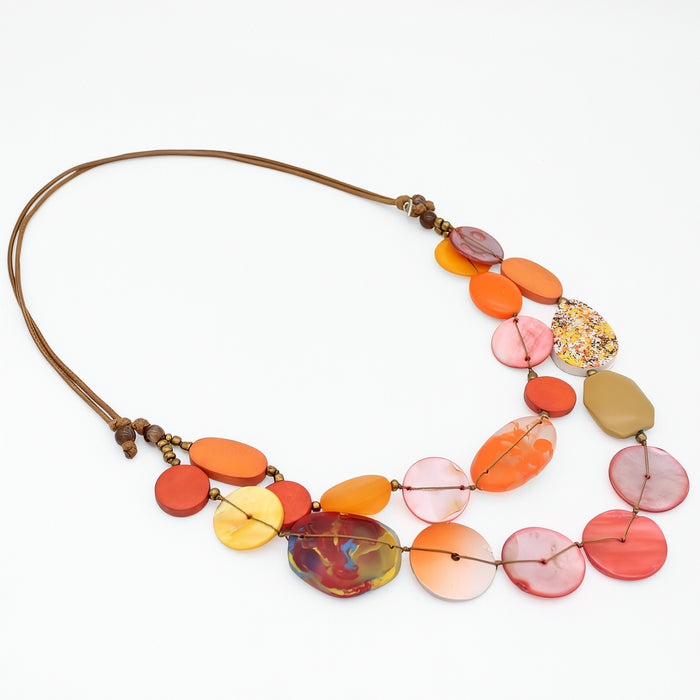 Colorful necklace with multicolored beads on a white background