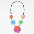 Necklace with colorful circular pendants on a white background