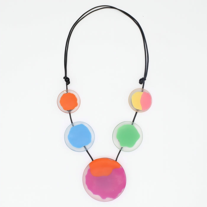 Necklace with colorful circular pendants on a white background