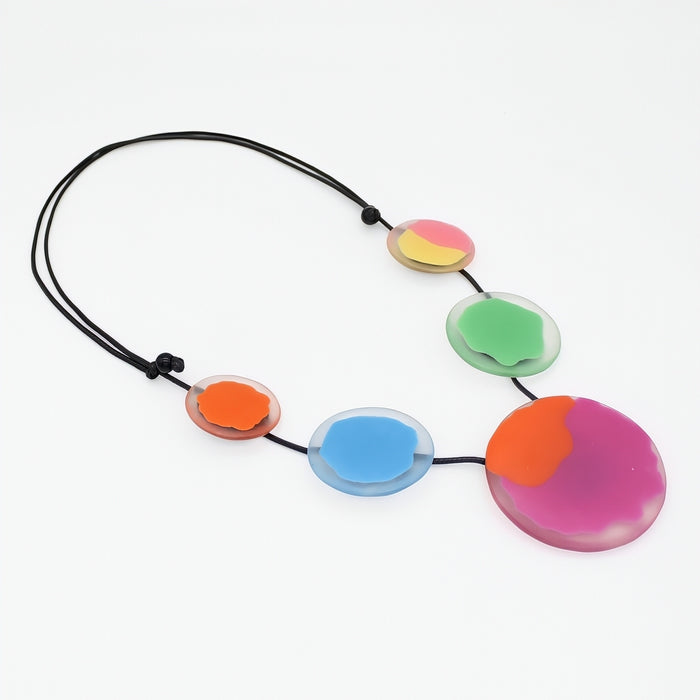 Necklace with colorful round pendants on a white background