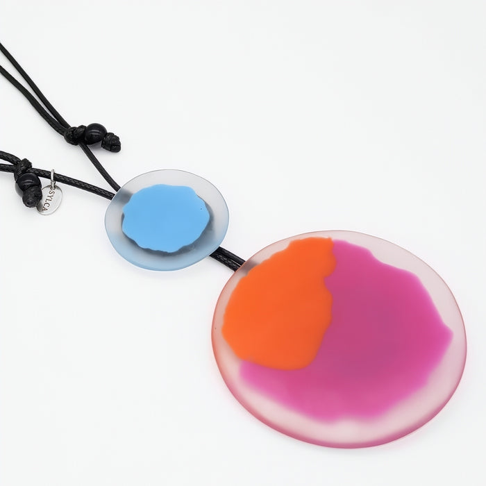 colorful pendant necklaces on a white background