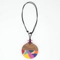 statement Necklace with a round, multicolored pendant on a white background