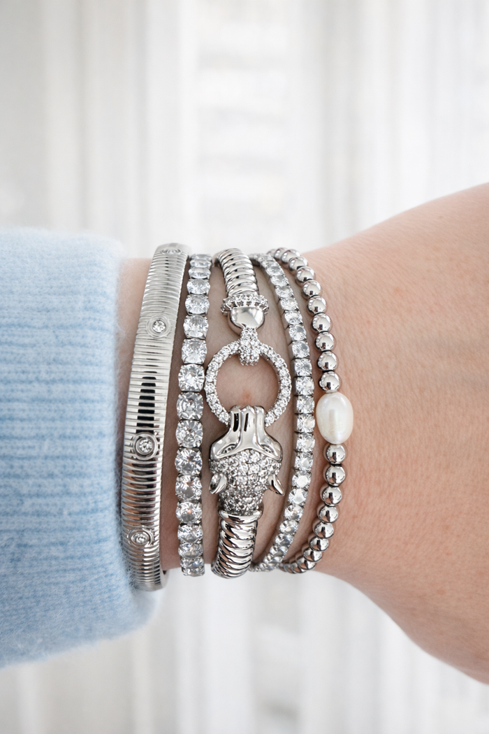 Panther bangle bracelet worn in a stacked bracelet look on wrist