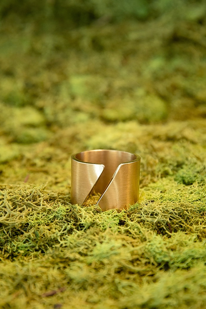 Shattered Dawn ring featuring bold sculptural cut out design in gold with modern artistic shape