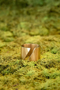 Shattered Dawn ring featuring bold sculptural cut out design in gold with modern artistic shape