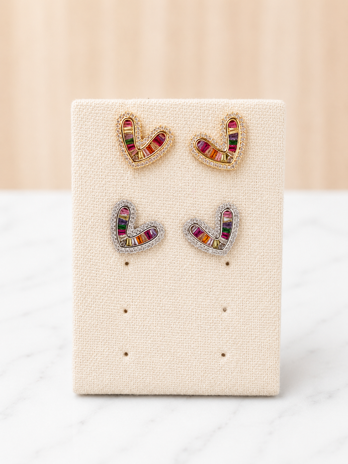 Simone Heart Studs in gold and silver with multicolor baguette gemstones on a linen earring display card