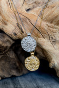 VEITA Jewelry Solana Necklace shown in gold and silver with round celestial sun and moon pendants