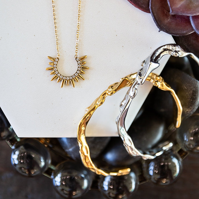 VEITA Jewelry Alchemy Collection Fall 2026 featuring layered gold and silver jewelry with mixed metal bracelet styling