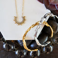 VEITA Jewelry Alchemy Collection Fall 2026 featuring layered gold and silver jewelry with mixed metal bracelet styling